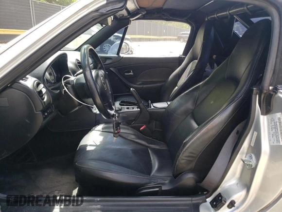 2004 Mazda MX-5 Miata LS with VIN JM1NB353640400140, listed as a Copart auction lot 56127165 with 123,276 mi miles and Salvage title. Bid and sale history available at DreamBid. Image 7.
