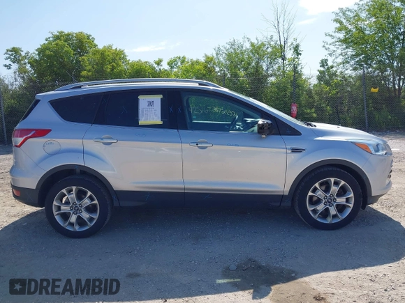 2015 Ford Escape Titanium with VIN 1FMCU9J94FUA65188, listed as a IAAI auction lot 42516728 with 65,969 mi miles and . Bid and sale history available at DreamBid. Image 13.