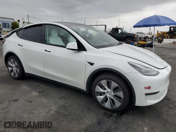 2021 Tesla Model Y Long Range with VIN 5YJYGDEEXMF151686, listed as a Copart auction lot 53903115 with 65,321 mi miles and Salvage Title. Bid and sale history available at DreamBid. Image 4.