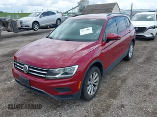 2018 Volkswagen Tiguan S with VIN 3VV1B7AX3JM045193, listed as a IAAI auction lot 42311886 with 69,049 mi miles and . Bid and sale history available at DreamBid. Image 2.