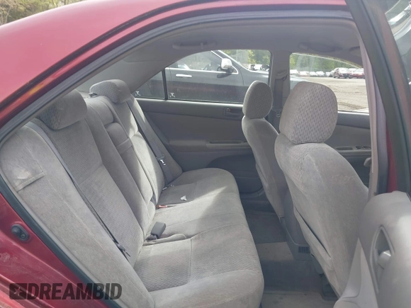 2003 Toyota Camry LE z VIN 4T1BF32K63U050174, wystawiony jako IAAI lot #42260843 z przebiegiem 210 486 mil mil oraz . Historia ofert i sprzedaży dostępna na DreamBid. Obrazek 8.