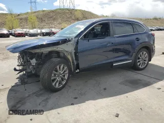 2021 Mazda CX-9 Grand Touring z VIN JM3TCBDY6M0512276, wystawiony jako Copart lot #54582375 z przebiegiem 26 727 mil mil oraz Szkoda całkowita • Salvage title. Historia ofert i sprzedaży dostępna na DreamBid. Obrazek 1.