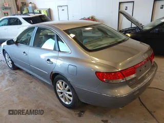 2007 Hyundai Azera SE z VIN KMHFC46F87A173110, wystawiony jako IAAI lot #42275974 z przebiegiem 208 901 mil mil oraz . Historia ofert i sprzedaży dostępna na DreamBid. Obrazek 3.