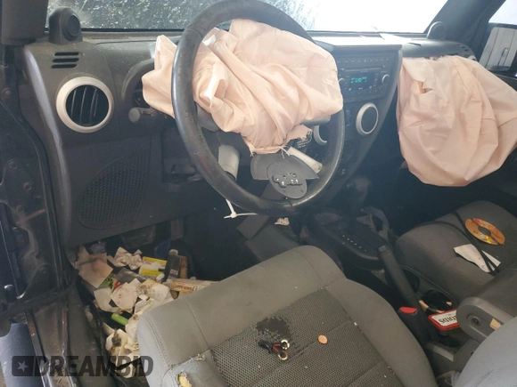 2009 Jeep Wrangler Sahara with VIN 1J4FA54159L772622, listed as a Copart auction lot 55648305 with 141,880 mi miles and Salvage title. Bid and sale history available at DreamBid. Image 8.