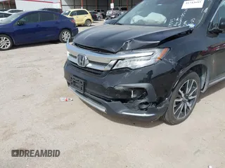 2020 Honda Pilot Touring 8-Passenger with VIN 5FNYF6H91LB003552, listed as a IAAI auction lot 41743685 with 76,725 mi miles and . Bid and sale history available at DreamBid. Image 6.