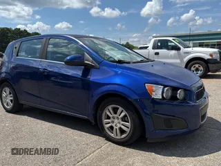 2012 Chevrolet Sonic LT with VIN 1G1JC6SH2C4216472, listed as a Copart auction lot 63713055 with 128,670 mi miles and Clean title. Bid and sale history available at DreamBid. Image 1.