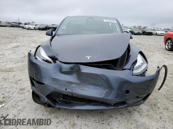 2021 Tesla Model Y Long Range z VIN 5YJYGDEE0MF254020, wystawiony jako Copart lot #51666865 z przebiegiem 25 805 mil mil oraz Szkoda całkowita • Salvage title. Historia ofert i sprzedaży dostępna na DreamBid. Obrazek 5.
