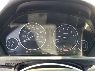2014 BMW 4 Series 428i xDrive with VIN WBA3N5C51EF716572, listed as a Copart auction lot 52086365 with 209,742 mi miles and Salvage Title. Bid and sale history available at DreamBid. Image 9.