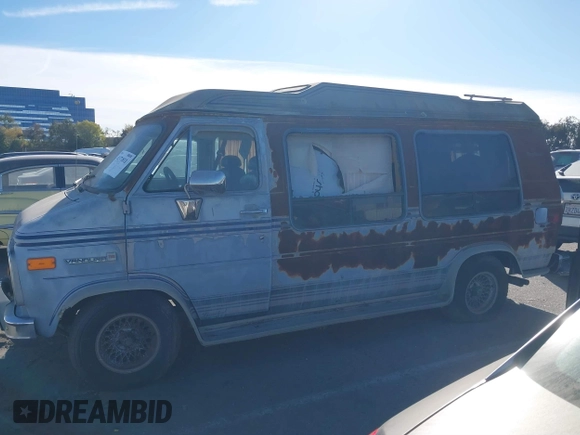 1989 GMC Vandura z VIN 1GDEG25K1K7521984, wystawiony jako IAAI lot #41371811 z przebiegiem 43 502 mil mil oraz . Historia ofert i sprzedaży dostępna na DreamBid. Obrazek 13.