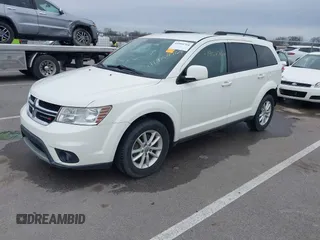 2013 Dodge Journey SXT with VIN 3C4PDCBG9DT564303, listed as a IAAI auction lot 41954764 with 132,125 mi miles. Bid and sale history available at carsss.com. Image 2.