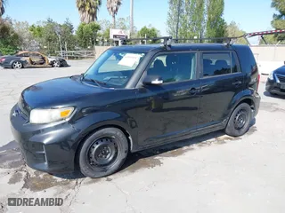 2012 Scion xB with VIN JTLZE4FE4C1143412, listed as a IAAI auction lot 42091929 with 213,501 mi miles. Bid and sale history available at carsss.com. Image 2.