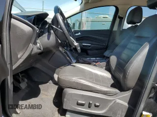 2015 Ford Escape Titanium with VIN 1FMCU0J97FUC80446, listed as a Copart auction lot 58749895 with 106,890 mi miles and Salvage title. Bid and sale history available at DreamBid. Image 7.