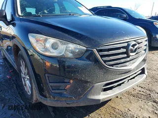 2016 Mazda CX-5 Sport with VIN JM3KE4BY0G0662294, listed as a IAAI auction lot 41469721 with 127,116 mi miles and . Bid and sale history available at carsss.com. Image 6.