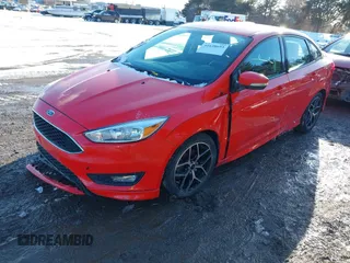 2015 Ford Focus SE with VIN 1FADP3F24FL367357, listed as a IAAI auction lot 41638693 with 107,379 mi miles. Bid and sale history available at carsss.com. Image 2.