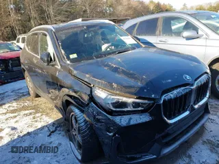 2023 BMW X1 xDrive28i with VIN WBX73EF02P5W66061, listed as a IAAI auction lot 41296411 with 30,308 mi miles. Bid and sale history available at carsss.com. Image 1.