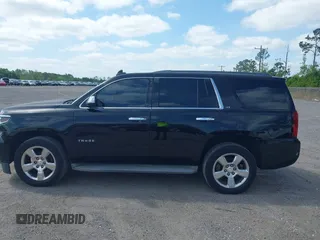 2015 Chevrolet Tahoe LT with VIN 1GNSCBKC1FR615817, listed as a IAAI auction lot 41760474 with 242,148 mi miles and . Bid and sale history available at DreamBid. Image 14.