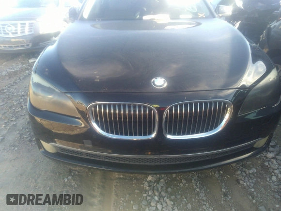 2011 BMW 7 Series 740i with VIN WBAKA4C55BC612634, listed as a IAAI auction lot 35404385 with 156,003 mi miles. Bid and sale history available at carsss.com. Image 6.