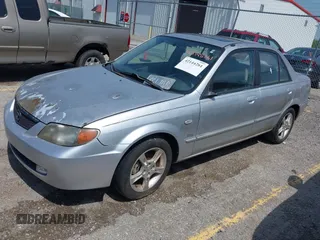 2003 Mazda Protege DX z VIN JM1BJ225430131527, wystawiony jako IAAI lot #42144261 z przebiegiem 215 988 mil mil oraz . Historia ofert i sprzedaży dostępna na DreamBid. Obrazek 2.