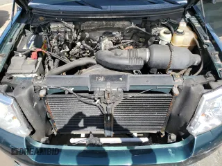2007 Ford F-150 STX with VIN 1FTRX14W57FB39989, listed as a Copart auction lot 50695635 with 252,852 mi miles and Salvage title. Bid and sale history available at DreamBid. Image 11.