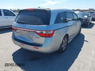 2012 Honda Odyssey Touring with VIN 5FNRL5H90CB099519, listed as a IAAI auction lot 41854550 with 185,110 mi miles. Bid and sale history available at carsss.com. Image 4.