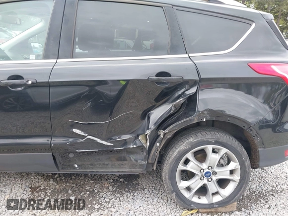 2014 Ford Escape Titanium with VIN 1FMCU9J95EUD60587, listed as a IAAI auction lot 42129854 with 155,559 mi miles and . Bid and sale history available at DreamBid. Image 6.