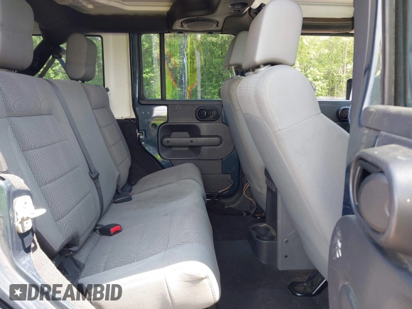 2007 Jeep Wrangler Unlimited Sahara with VIN 1J4GA59117L216687, listed as a IAAI auction lot 42188257 with 176,507 mi miles and . Bid and sale history available at DreamBid. Image 8.
