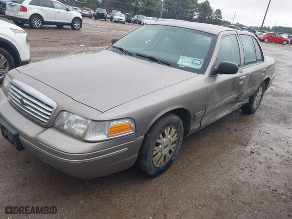 2005 Ford Crown Victoria LX with VIN 2FAFP74W05X174758, listed as a IAAI auction lot 41553606 with 192,103 mi miles. Bid and sale history available at carsss.com. Image 2.