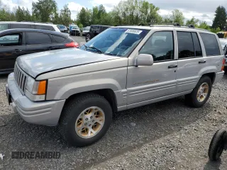 1998 Jeep Grand Cherokee Limited with VIN 1J4GZ78Y0WC245194, listed as a Copart auction lot 57838825 with 199,412 mi miles and Salvage title. Bid and sale history available at DreamBid. Image 1.
