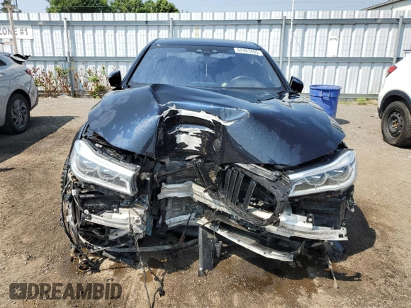2017 BMW 7 Series 750i xDrive with VIN WBA7B0C57HG527064, listed as a Copart auction lot 62463405 with 103,454 mi miles and Salvage title. Bid and sale history available at DreamBid. Image 5.
