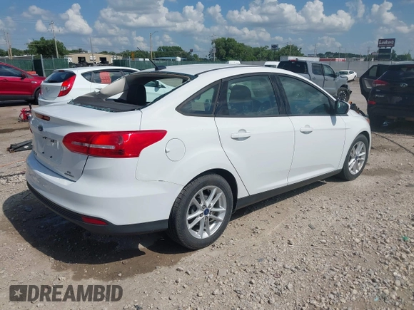 2015 Ford Focus SE with VIN 1FADP3F2XFL335884, listed as a IAAI auction lot 42582740 with 102,036 mi miles and . Bid and sale history available at DreamBid. Image 4.