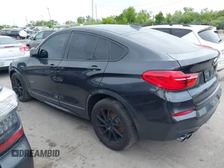 2015 BMW X4 xDrive28i with VIN 5UXXW3C54F0M88740, listed as a IAAI auction lot 42275157 with 159,281 mi miles and . Bid and sale history available at DreamBid. Image 3.