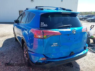 2017 Toyota RAV4 LE with VIN 2T3ZFREV2HW404424, listed as a IAAI auction lot 41862300 with 164,267 mi miles and . Bid and sale history available at carsss.com. Image 3.