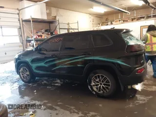 2015 Jeep Cherokee Sport with VIN 1C4PJMAB6FW773953, listed as a IAAI auction lot 41565879 with 242,580 mi miles. Bid and sale history available at carsss.com. Image 14.