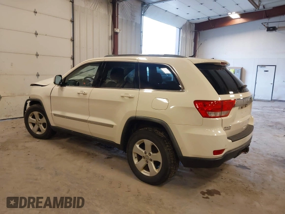 2011 Jeep Grand Cherokee 70th Anniversary with VIN 1J4RR4GG4BC702759, listed as a IAAI auction lot 41871604 with 143,583 mi miles. Bid and sale history available at carsss.com. Image 3.