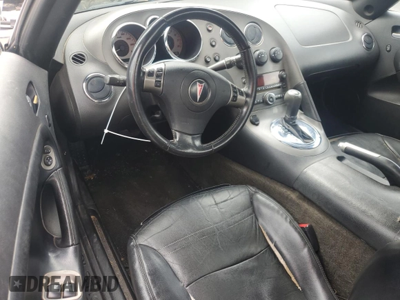 2008 Pontiac Solstice z VIN 1G2MB35B78Y104316, wystawiony jako Copart lot #58829185 z przebiegiem 194 147 mil mil oraz Tytuł czysty. Historia ofert i sprzedaży dostępna na DreamBid. Obrazek 8.