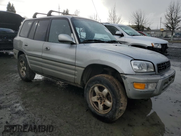 2000 Toyota RAV4 with VIN JT3HP10V7Y7169097, listed as a Copart auction lot 43357225 with 295,509 mi miles and Salvage title. Bid and sale history available at DreamBid. Image 4.
