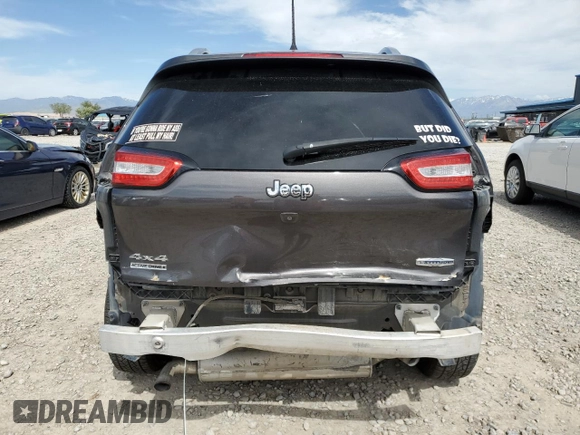 2018 Jeep Cherokee Latitude Plus with VIN 1C4PJMLX0JD562180, listed as a Copart auction lot 57631285 with 105,923 mi miles and Salvage title. Bid and sale history available at DreamBid. Image 6.