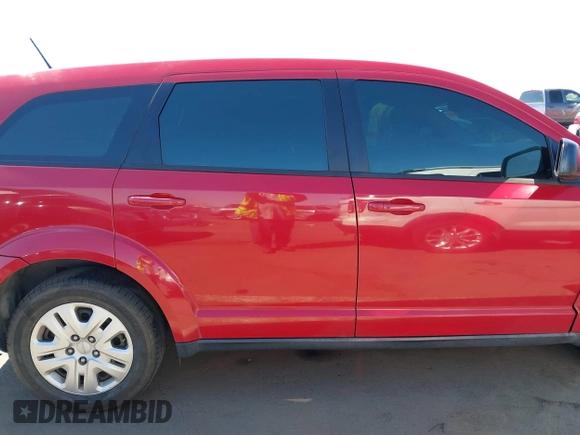2015 Dodge Journey SE z VIN 3C4PDCAB9FT587668, wystawiony jako IAAI lot #41868556 z przebiegiem 99 695 mil mil oraz . Historia ofert i sprzedaży dostępna na DreamBid. Obrazek 13.
