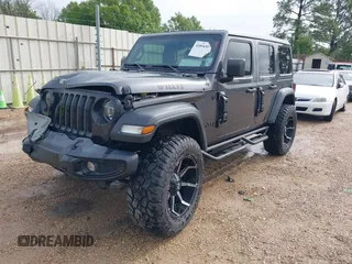2021 Jeep Wrangler Unlimited Sport S with VIN 1C4HJXDG2MW700461, listed as a IAAI auction lot 41894307 with 82,454 mi miles. Bid and sale history available at carsss.com. Image 17.