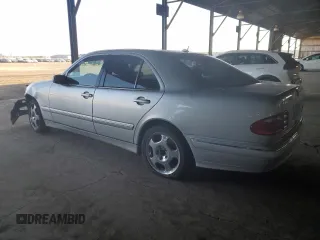 2001 Mercedes-Benz E-Class with VIN WDBJF70J51B167821, listed as a Copart auction lot 81113074 with 203,608 mi miles and Salvage Title. Bid and sale history available at carsss.com. Image 2.
