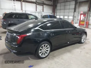 2021 Cadillac CT5 Luxury z VIN 1G6DX5RK0M0147667, wystawiony jako IAAI lot #41398726 z przebiegiem 50 387 mil mil oraz . Historia ofert i sprzedaży dostępna na DreamBid. Obrazek 4.