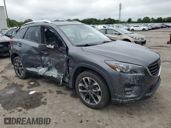 2016 Mazda CX-5 Grand Touring z VIN JM3KE4DY5G0741800, wystawiony jako Copart lot #58565455 z przebiegiem 33 675 mil mil oraz Szkoda całkowita • Salvage title. Historia ofert i sprzedaży dostępna na DreamBid. Obrazek 4.