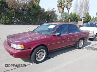 1991 Toyota Camry z VIN JT2SV21E0M3462782, wystawiony jako IAAI lot #41841451 z przebiegiem 214 611 mil mil oraz . Historia ofert i sprzedaży dostępna na DreamBid. Obrazek 2.