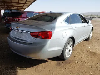 2014 Chevrolet Impala LT with VIN 1G1115SL6EU105818, listed as a IAAI auction lot 41678040 with 139,686 mi miles and . Bid and sale history available at DreamBid. Image 4.