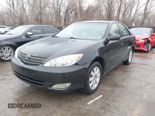 2004 Toyota Camry LE with VIN 4T1BF32K84U074364, listed as a IAAI auction lot 41479264 with 265,865 mi miles. Bid and sale history available at carsss.com. Image 2.