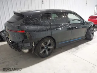 2023 BMW iX xDrive50 with VIN WB523CF04PCL15607, listed as a IAAI auction lot 41315457 with 44,058 mi miles. Bid and sale history available at carsss.com. Image 4.