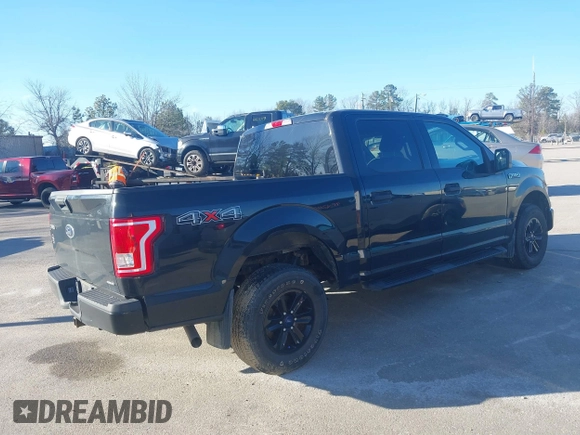 2015 Ford F-150 XLT with VIN 1FTEW1E86FFC00959, listed as a IAAI auction lot 41581711 with 130,298 mi miles. Bid and sale history available at carsss.com. Image 4.