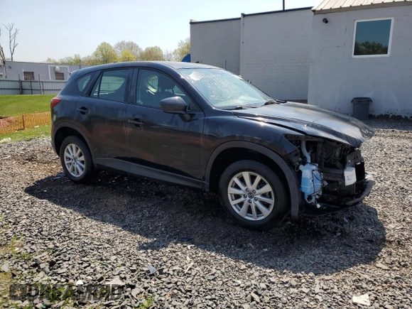 2014 Mazda CX-5 Sport with VIN JM3KE2BE8E0392545, listed as a Copart auction lot 54131455 with 63,917 mi miles and Salvage Title. Bid and sale history available at carsss.com. Image 4.