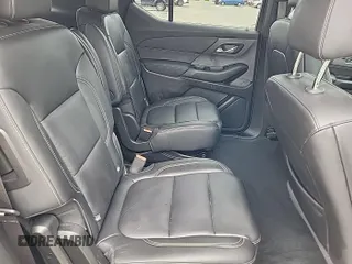 2023 Chevrolet Traverse LT z VIN 1GNEVHKW5PJ325679, wystawiony jako IAAI lot #42541394 z przebiegiem 74 480 mil mil oraz . Historia ofert i sprzedaży dostępna na DreamBid. Obrazek 7.