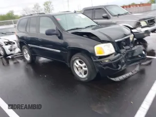 2007 GMC Envoy SLE with VIN 1GKDS13S872309605, listed as a IAAI auction lot 41946509 with 184,638 mi miles. Bid and sale history available at carsss.com. Image 1.